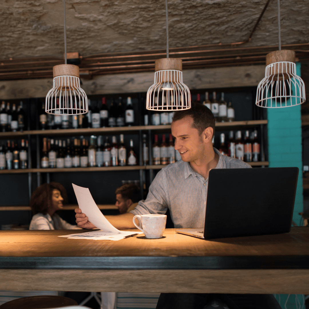 picture of a bar and restaurant owner working on his computer